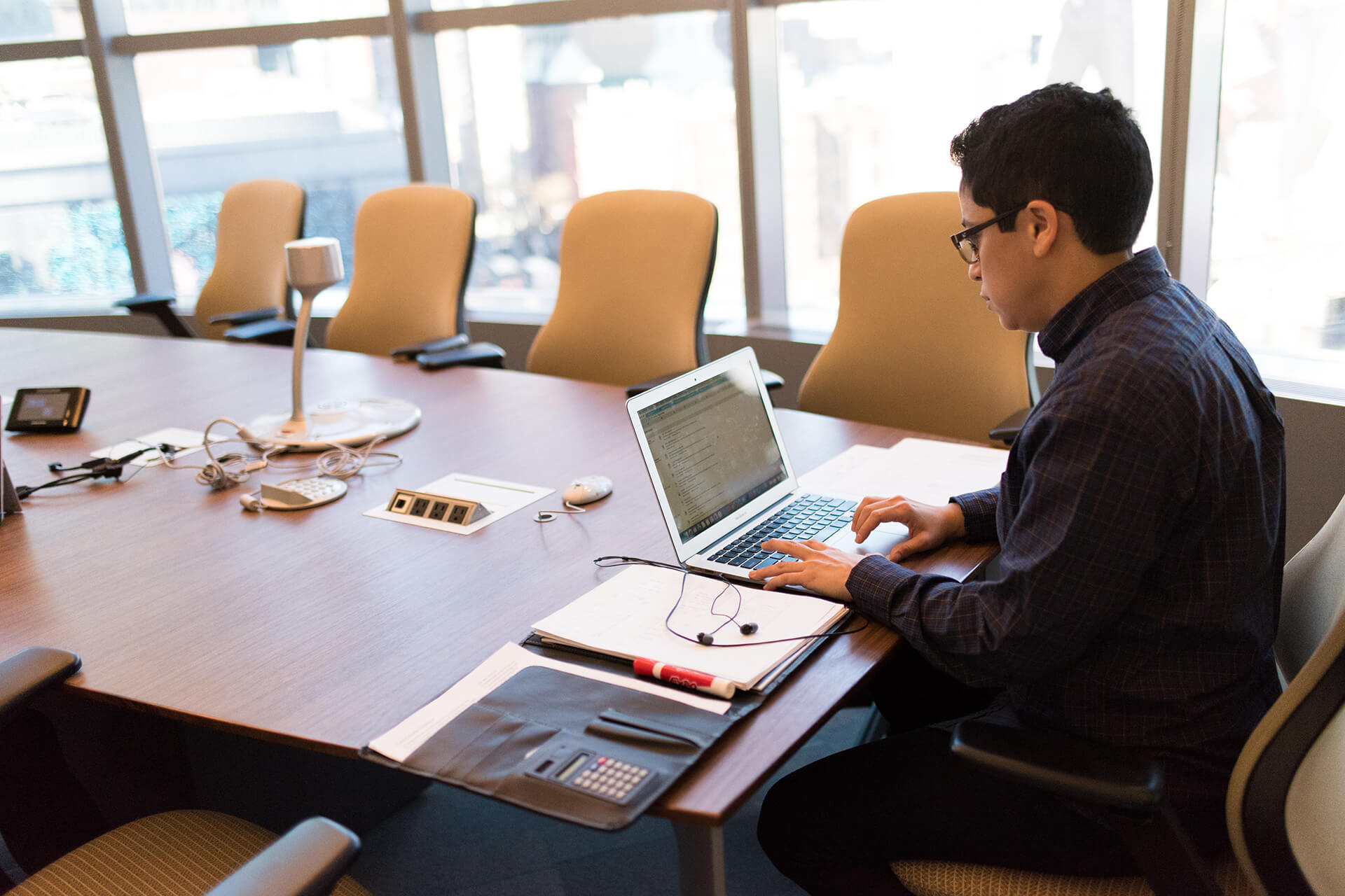 Professional reviewing business and investigation work in an office